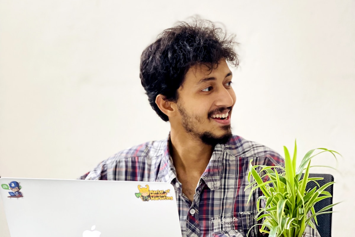 Developer sharing a laugh at his desk